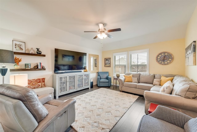 living area with ceiling fan and wood finished floors