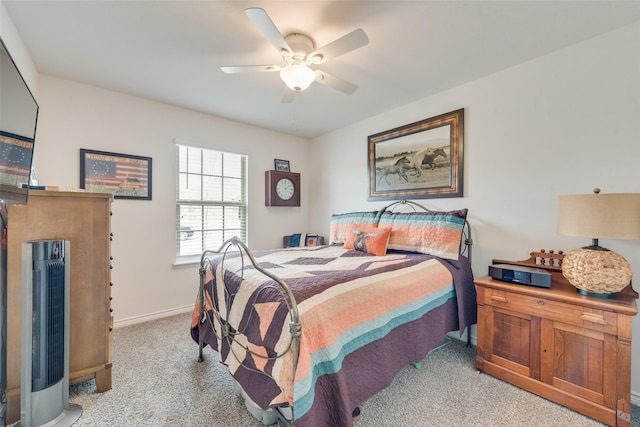 bedroom featuring carpet, baseboards, and ceiling fan