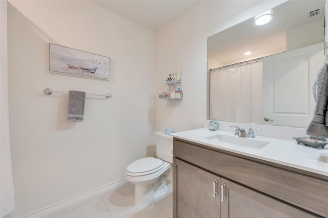 bathroom with visible vents, toilet, vanity, tile patterned flooring, and baseboards