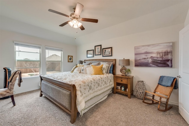 carpeted bedroom featuring a ceiling fan and baseboards