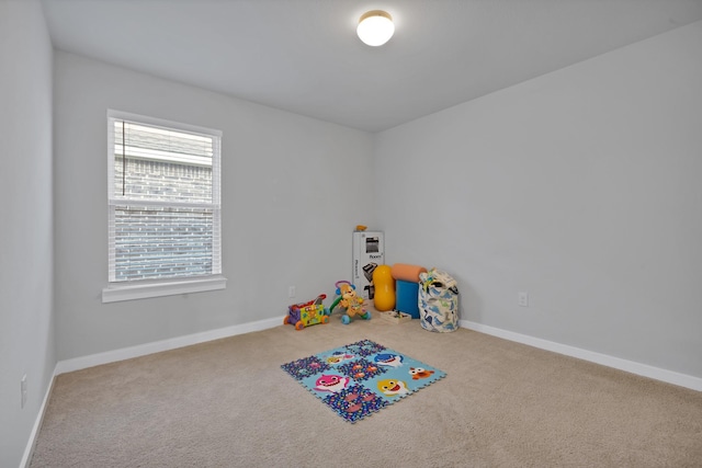 playroom with carpet and baseboards