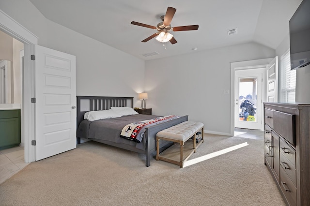 bedroom with a ceiling fan, light colored carpet, visible vents, and lofted ceiling