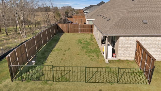 view of yard featuring a fenced backyard