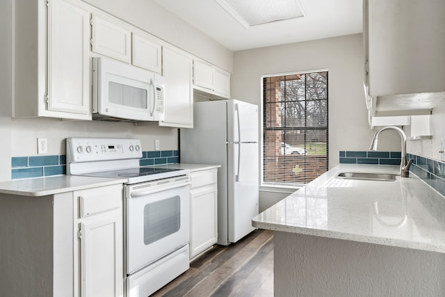 2901 Anysa Ln, Denton, TX 76209 - kitchen featuring white appliances, dark wood-style floors, and white cabinets