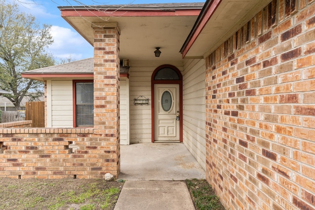 2901 Anysa Ln, Denton, TX 76209 - doorway to property with a shingled roof and brick siding