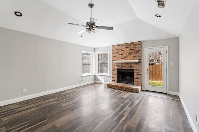 2901 Anysa Ln, Denton, TX 76209 - unfurnished living room with a ceiling fan, vaulted ceiling, a fireplace, and dark wood finished floors