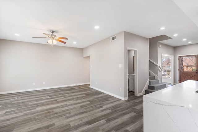 living room featuring a ceiling fan, wood finished floors, recessed lighting, stairway, and baseboards