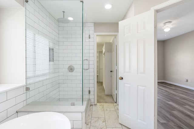 1542 Glenmore Dr, Lewisville, TX 75077 - bathroom featuring a stall shower, baseboards, a soaking tub, and recessed lighting