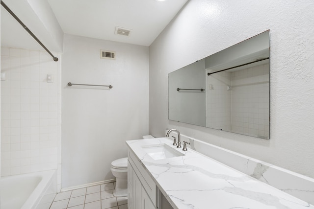 1542 Glenmore Dr, Lewisville, TX 75077 - bathroom featuring vanity, toilet, tile patterned flooring,  shower combination, and baseboards