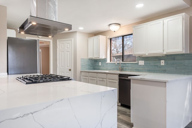 1542 Glenmore Dr, Lewisville, TX 75077 - kitchen with stainless steel appliances, island exhaust hood, a sink, light stone counters, and white cabinets