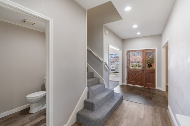 1542 Glenmore Dr, Lewisville, TX 75077 - entryway with wood finished floors, baseboards, stairway, and recessed lighting