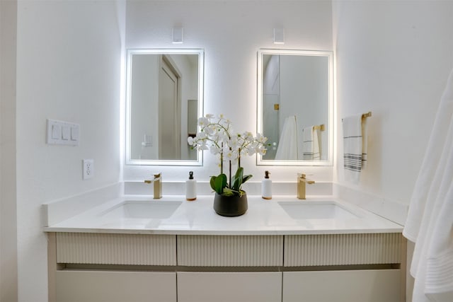 full bath with double vanity and a sink