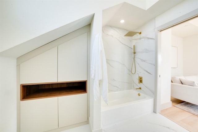 ensuite bathroom featuring recessed lighting, bathing tub / shower combination, and ensuite bathroom