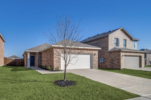 traditional-style house with driveway, brick siding, a front lawn, and fence