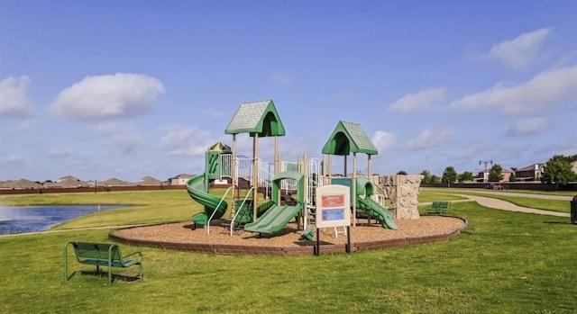 community play area featuring a lawn and a water view