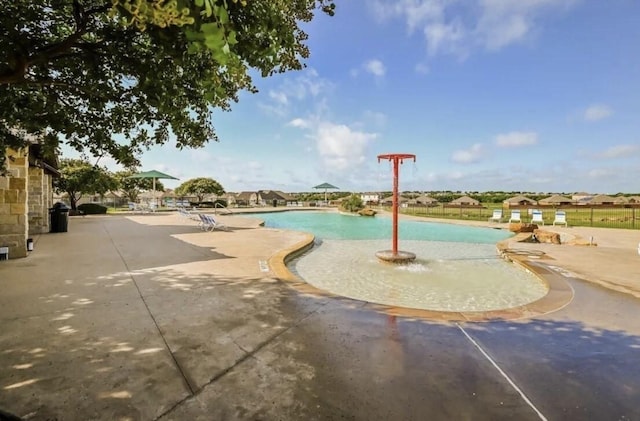 community pool with a patio