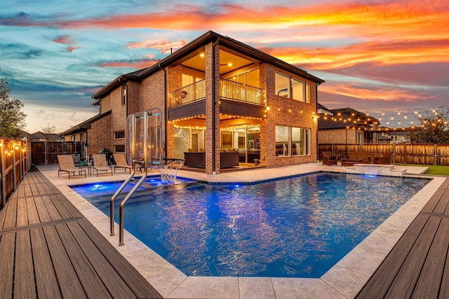 view of pool with a fenced in pool, an outdoor hangout area, an in ground hot tub, and a fenced backyard