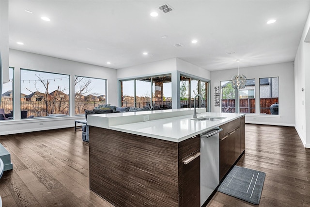 kitchen featuring visible vents, plenty of natural light, a sink, light countertops, and modern cabinets