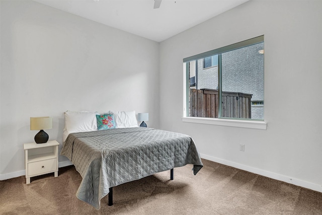 bedroom with carpet flooring, baseboards, and ceiling fan