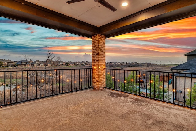 balcony featuring a residential view and ceiling fan