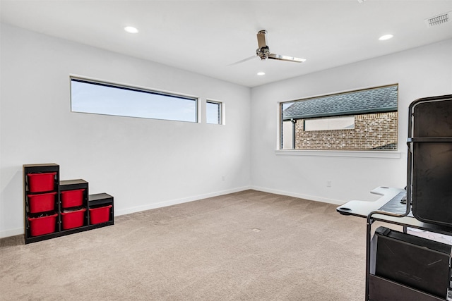 interior space with carpet flooring, recessed lighting, visible vents, and baseboards