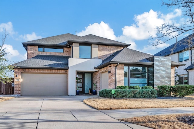 view of front of home featuring brick siding, driveway, a garage, and roof with shingles