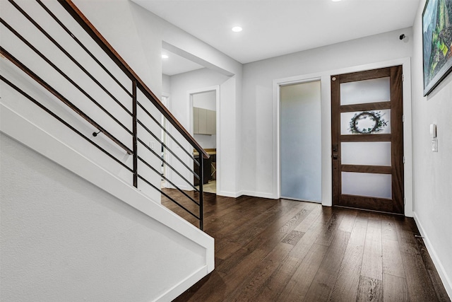 entryway featuring stairway, recessed lighting, baseboards, and dark wood-style flooring