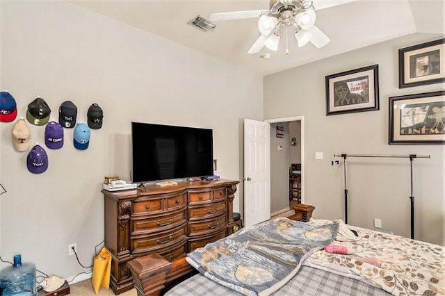 bedroom with visible vents, vaulted ceiling, and a ceiling fan