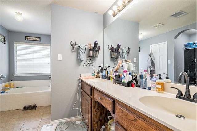 bathroom with tile patterned flooring, visible vents, and a sink