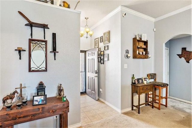 corridor with arched walkways, ornamental molding, carpet, and baseboards