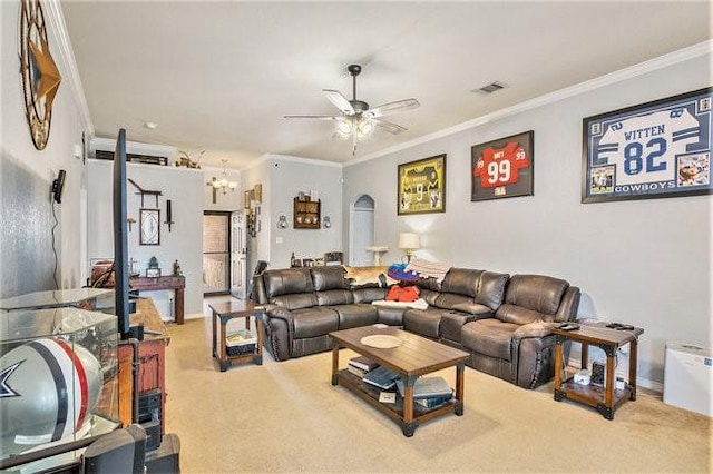 living area featuring carpet floors, arched walkways, ornamental molding, a ceiling fan, and baseboards