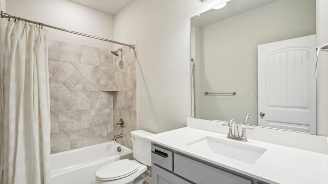 bathroom featuring vanity, shower / tub combo, and toilet