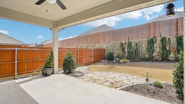 view of patio / terrace featuring a fenced backyard and ceiling fan