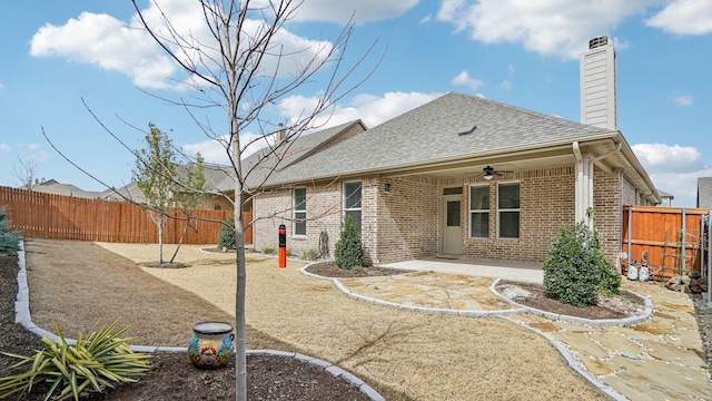 back of property featuring a patio, a fenced backyard, brick siding, and ceiling fan