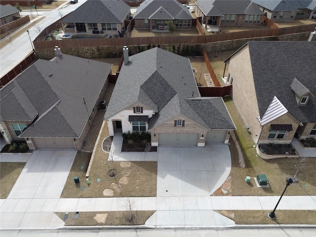 birds eye view of property with a residential view