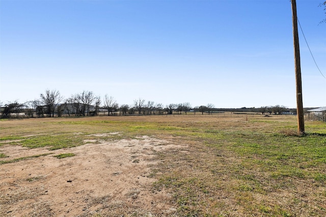 view of yard with a rural view