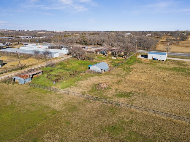 birds eye view of property with a rural view