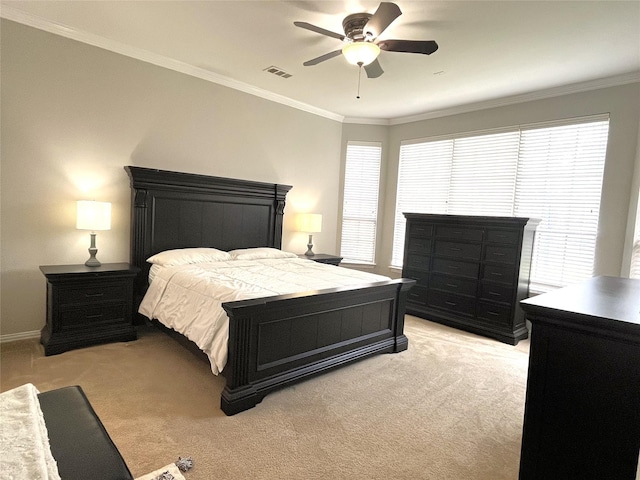 bedroom with baseboards, visible vents, ceiling fan, ornamental molding, and light colored carpet