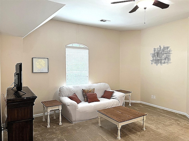 living room with visible vents, ceiling fan, and vaulted ceiling