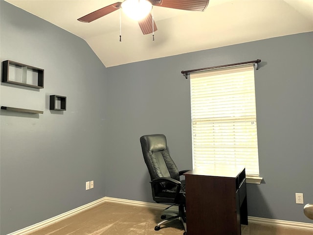 carpeted home office with plenty of natural light, ceiling fan, baseboards, and lofted ceiling