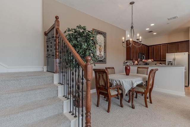 dining space with visible vents, light carpet, recessed lighting, a chandelier, and stairs