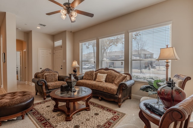 interior space featuring visible vents, baseboards, recessed lighting, arched walkways, and a ceiling fan