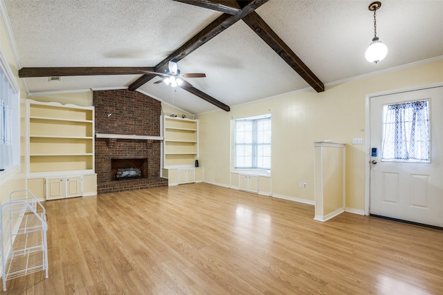 unfurnished living room with light wood-style flooring, vaulted ceiling with beams, and a textured ceiling