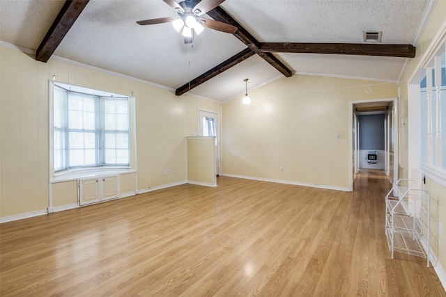 spare room featuring visible vents, vaulted ceiling with beams, light wood-style flooring, and a textured ceiling