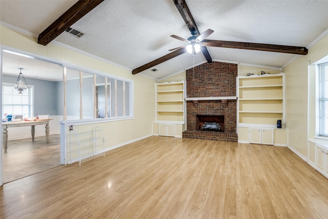 unfurnished living room featuring a textured ceiling, light wood-style flooring, a fireplace, and visible vents