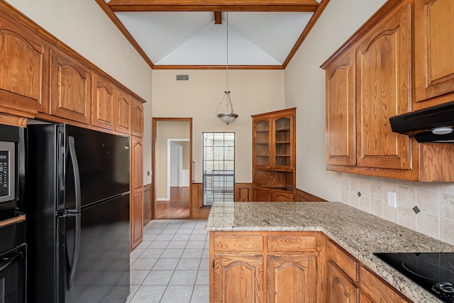 kitchen featuring under cabinet range hood, a peninsula, visible vents, ornamental molding, and black appliances