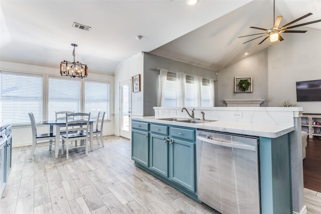 kitchen featuring visible vents, blue cabinetry, a sink, light wood-style floors, and dishwasher