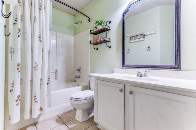 bathroom featuring tile patterned flooring, toilet, vanity, and shower / bath combo