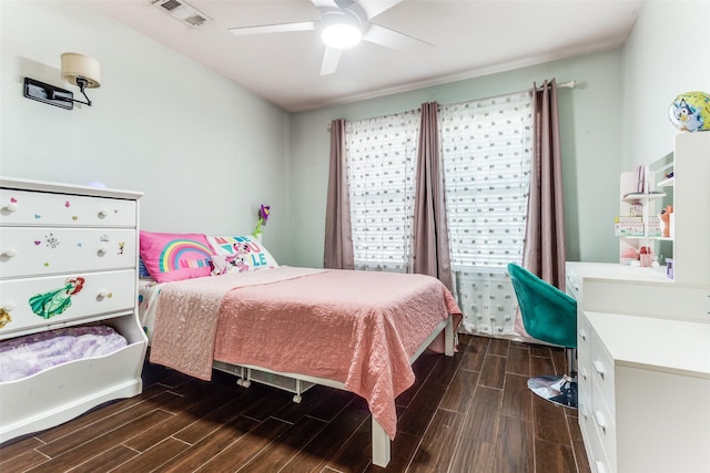 bedroom featuring visible vents, ceiling fan, and wood tiled floor