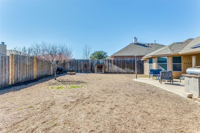 view of yard featuring a patio and a fenced backyard